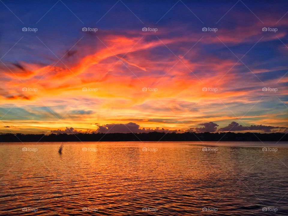 Dramatic sky reflecting in sea