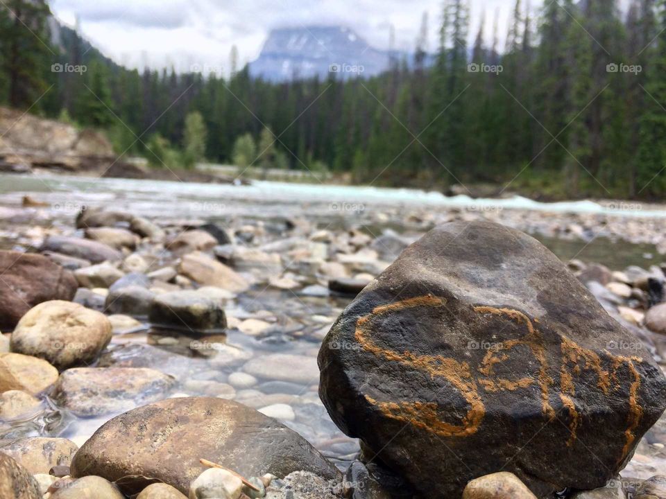 Sam writing on rock