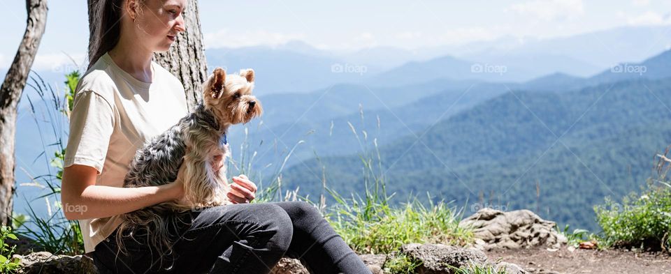 woman and dog in mountains