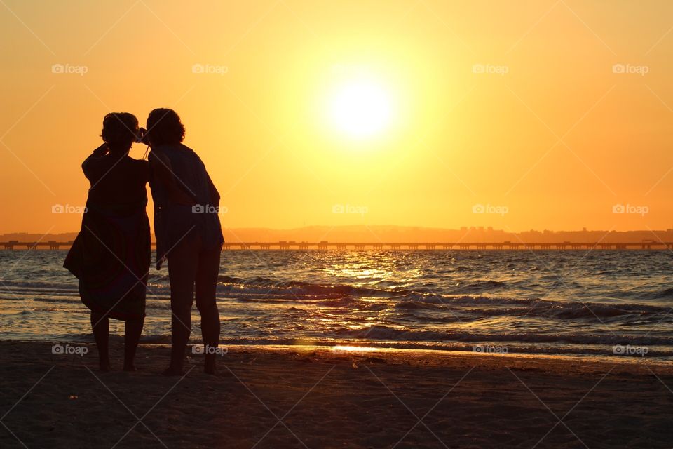 Women, Shadows, Sunset by the Sea 