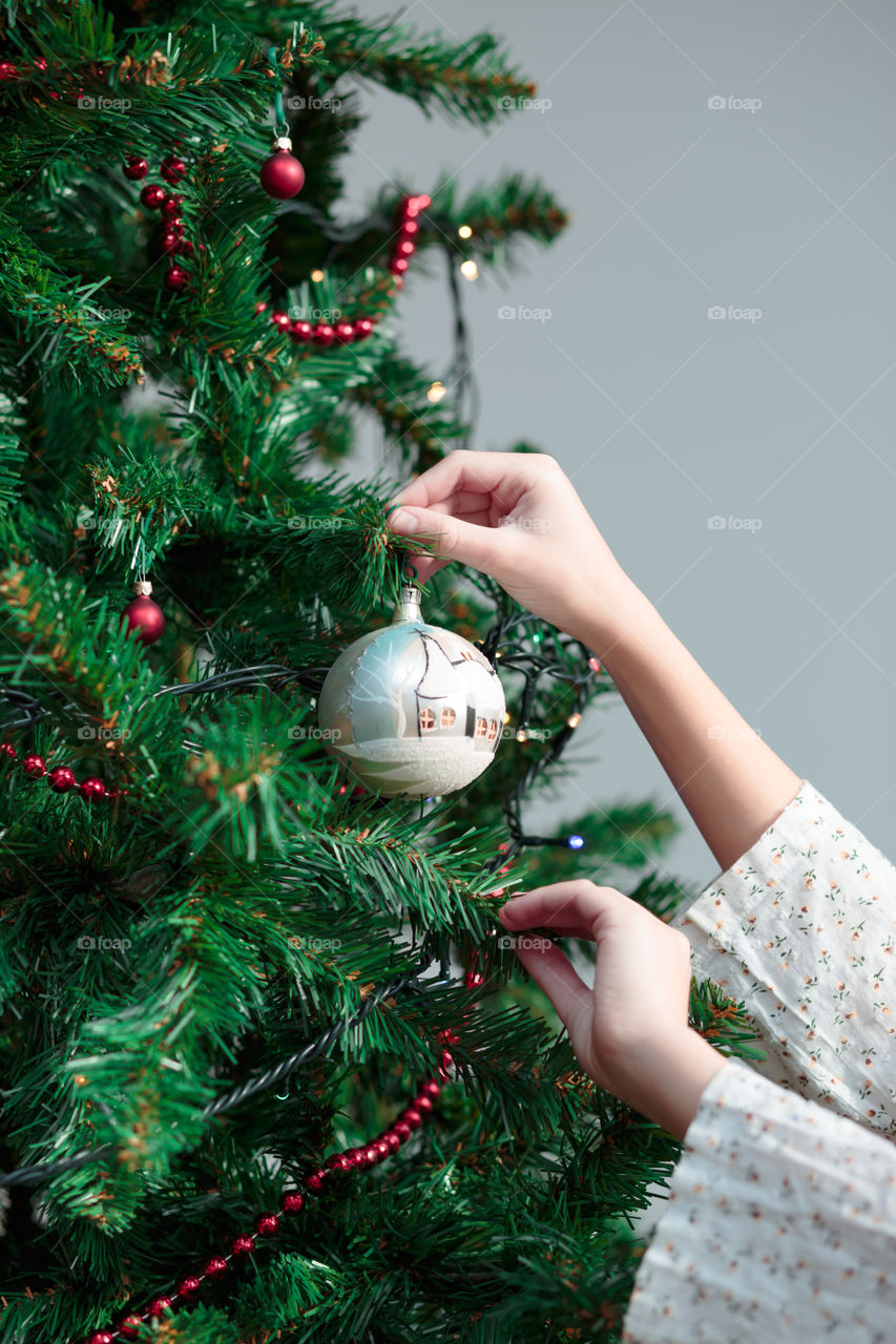 Woman decorating christmas tree