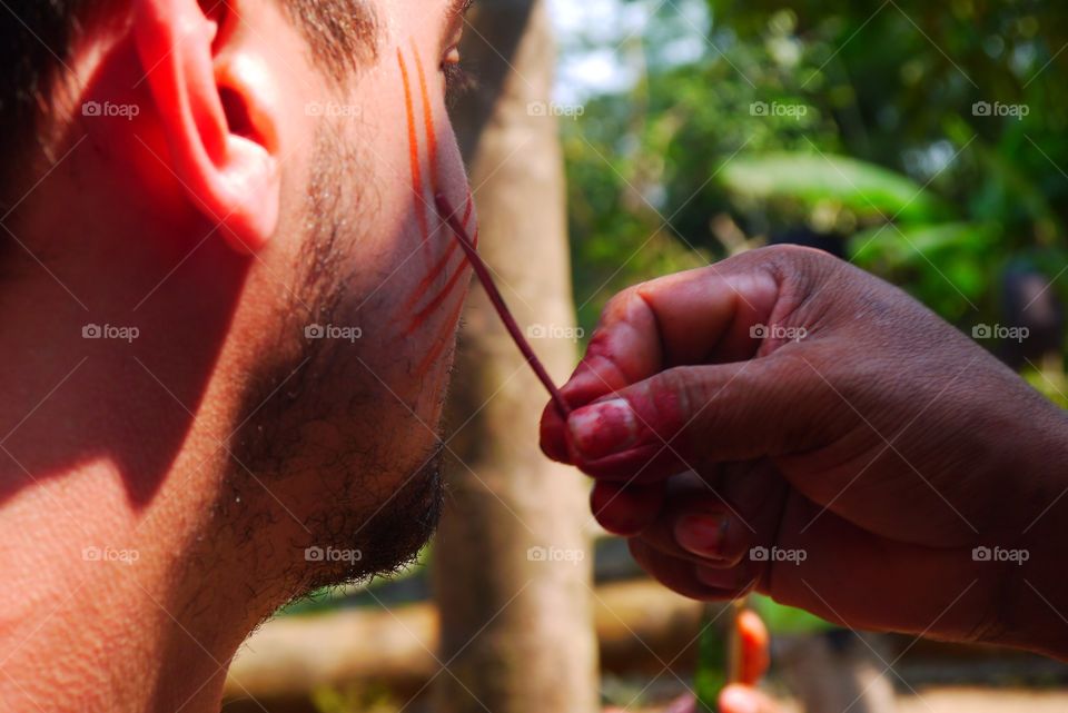 Body painting by a native in Amazon