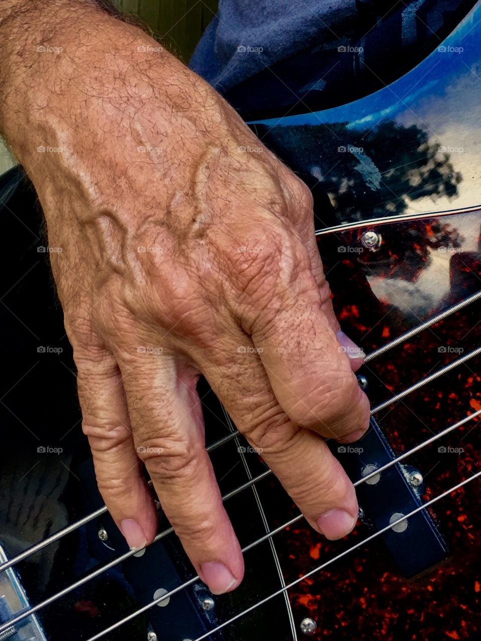 Senior man playing guitar