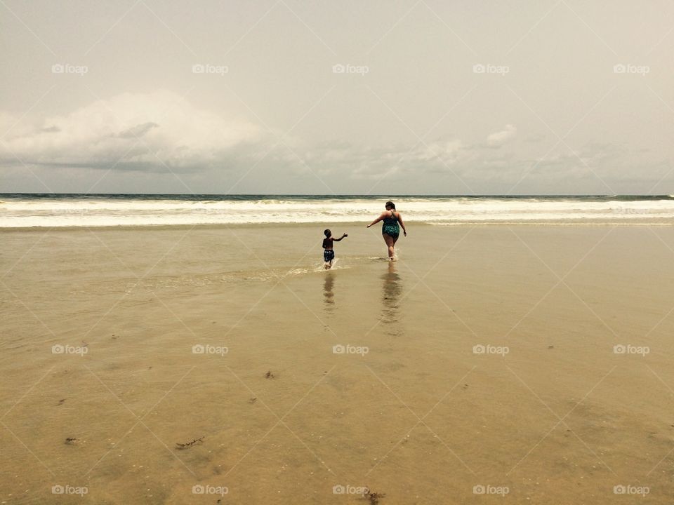 Mother and son on Beach in Ivory Coast 