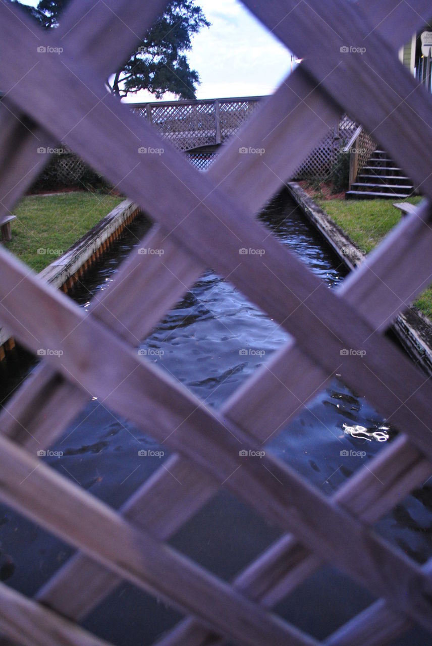 Water seen through the fence