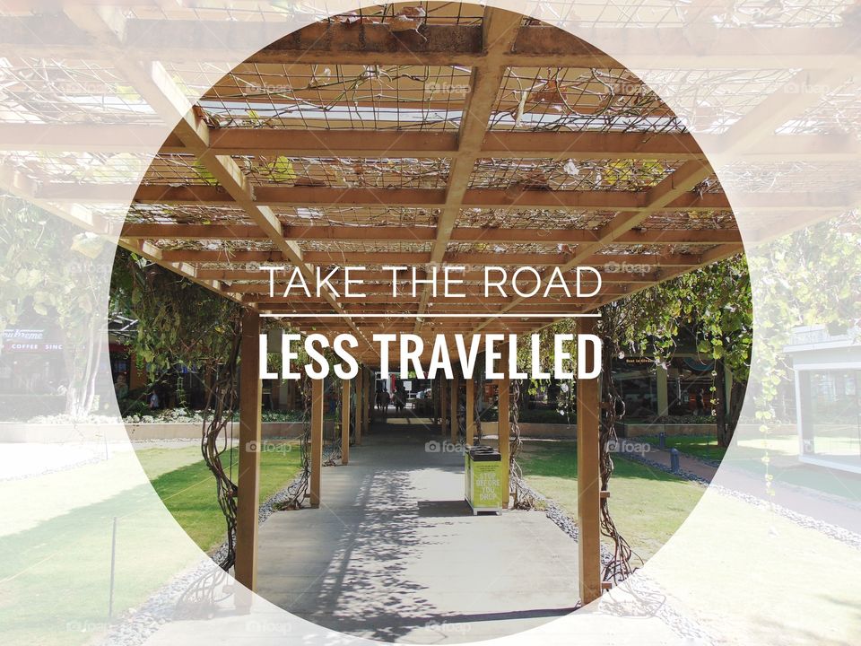 a motto saying take the road less travelled