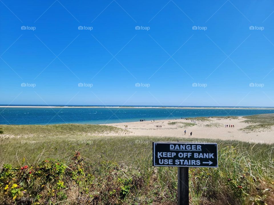 Danger sign with atlantic ocean in the background