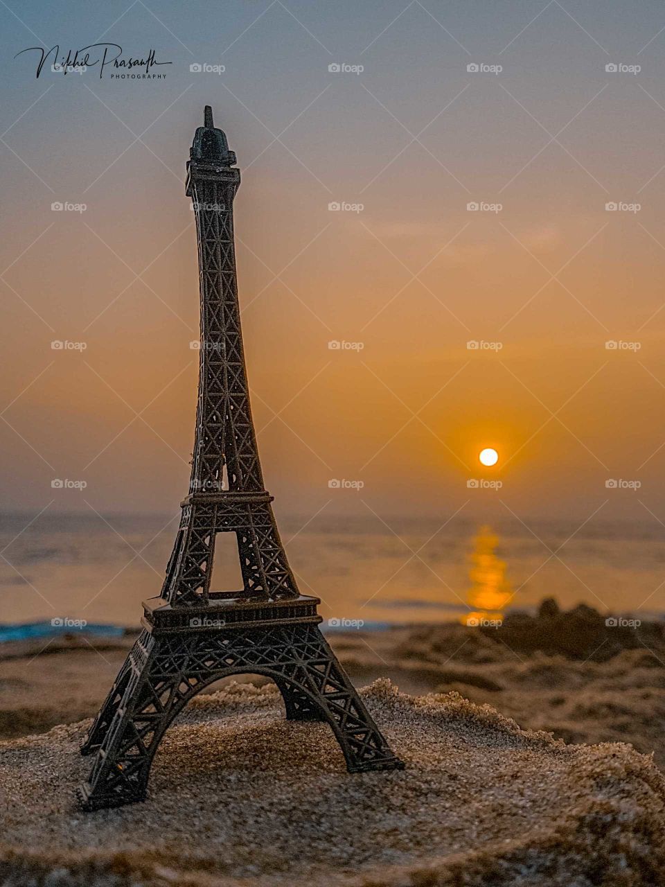 A Miniature Model of Eiffel Tower.. Shot during sunset at Varkala Beach, Kerala, India