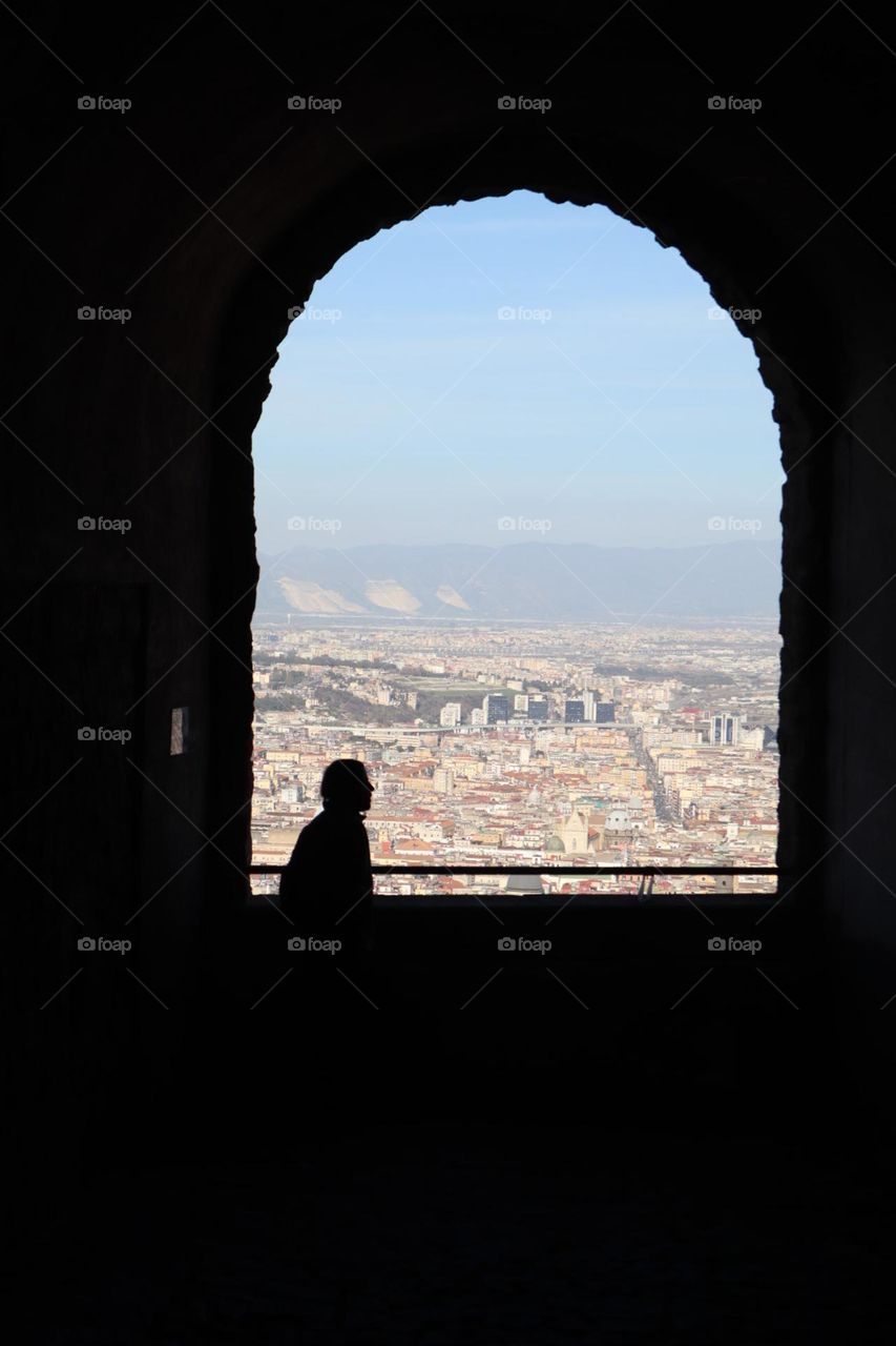 A man in the window watching Napoli Italy