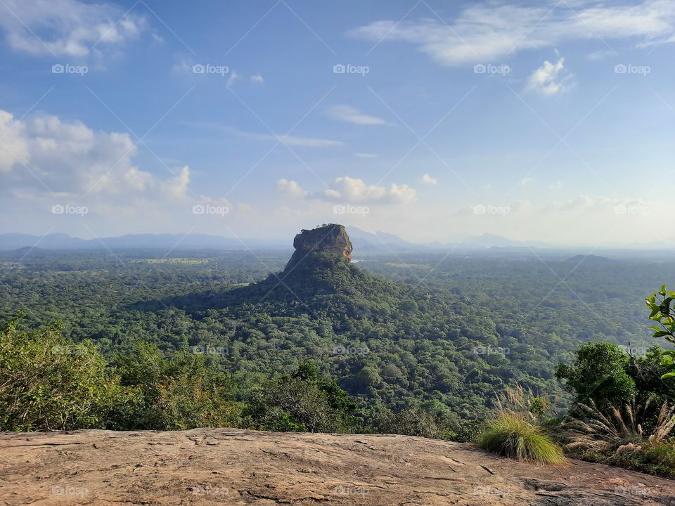 Sigiriya rock fortress. A UNESCO world heritage site with rich culture. Rising through the greenary. Nature at its best. True nature.