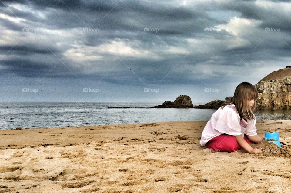 Girl playing at beach