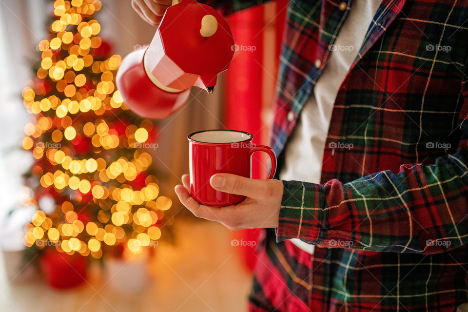 cup of coffee in a cozy festive Christmas atmosphere