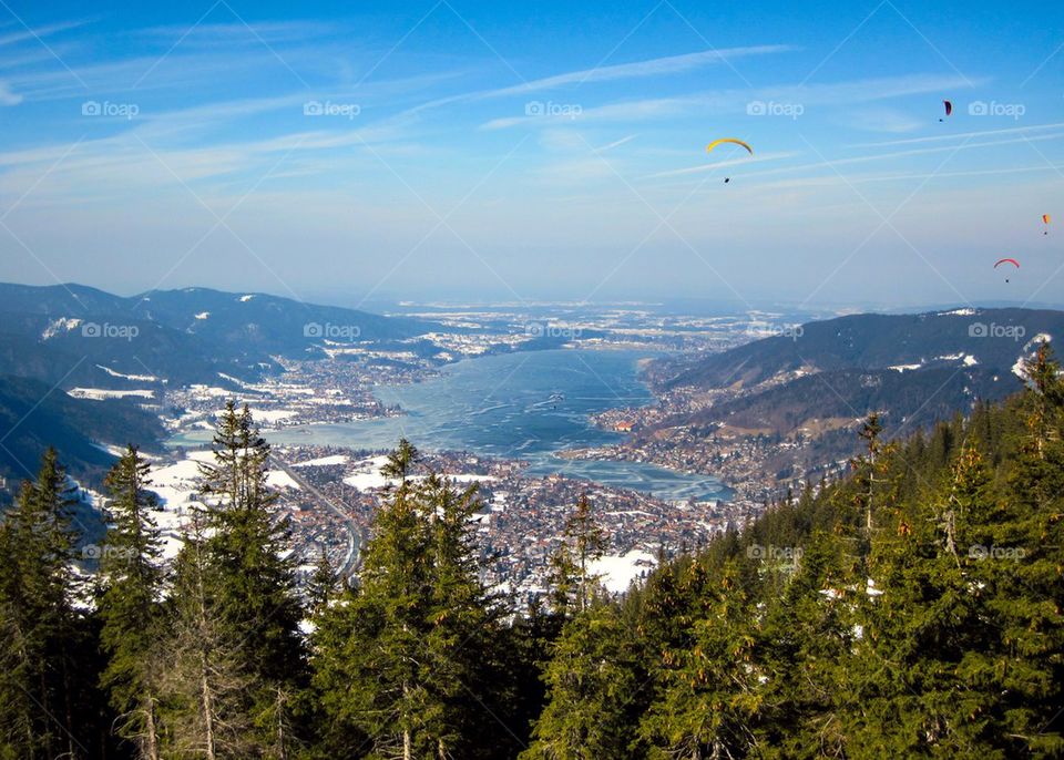 Paragliding over lake, Tegernsee, Bavaria, Germany