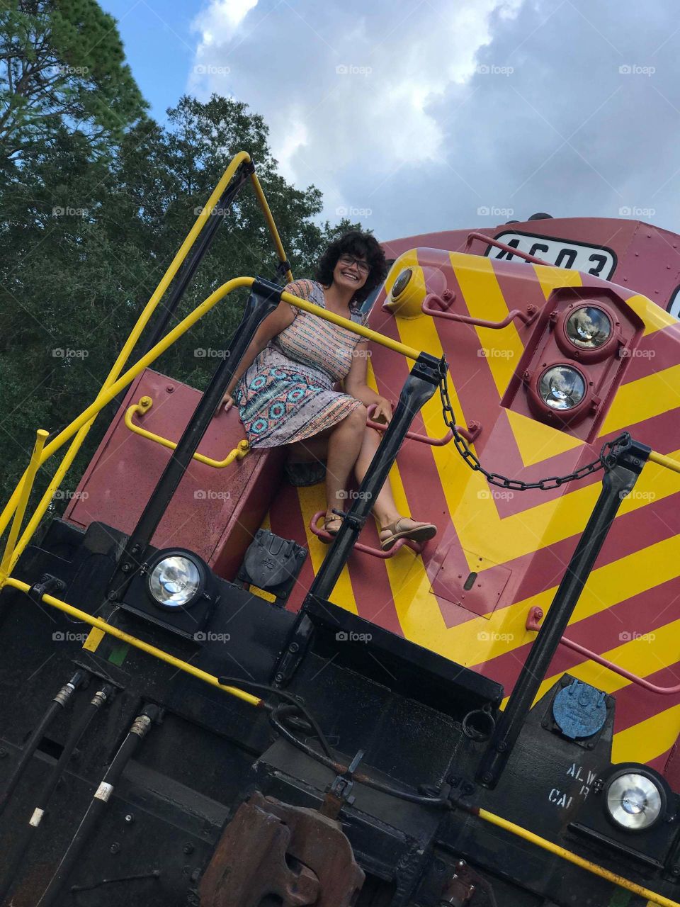 lady sitting on train engine