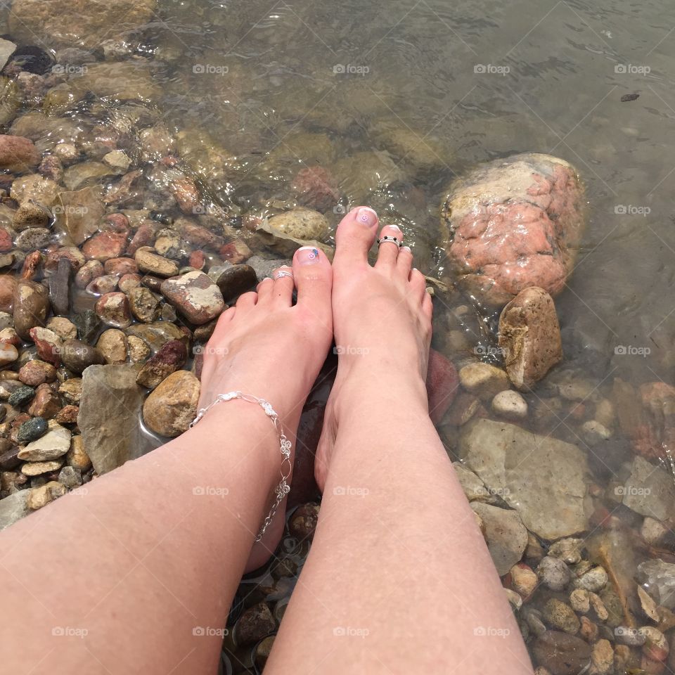 Sunbathing at the lake with my toes dipped in the cool water and the peaceful breeze on my face.