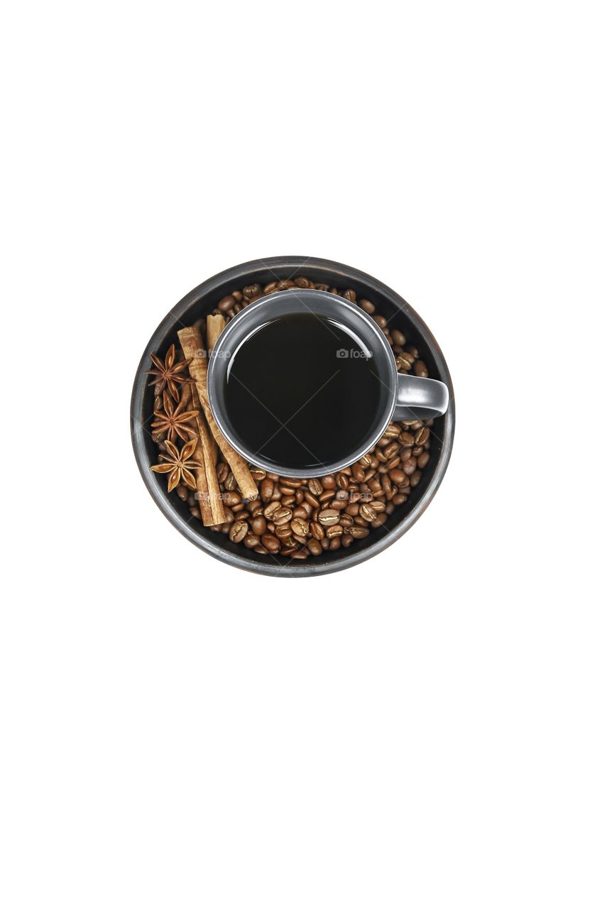 top view of coffee cup and coffee beans on white background