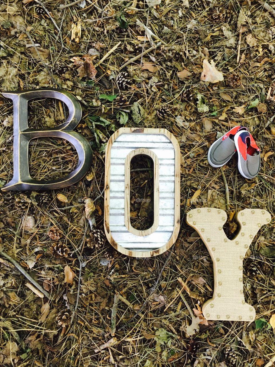 Boy text made of wood on ground