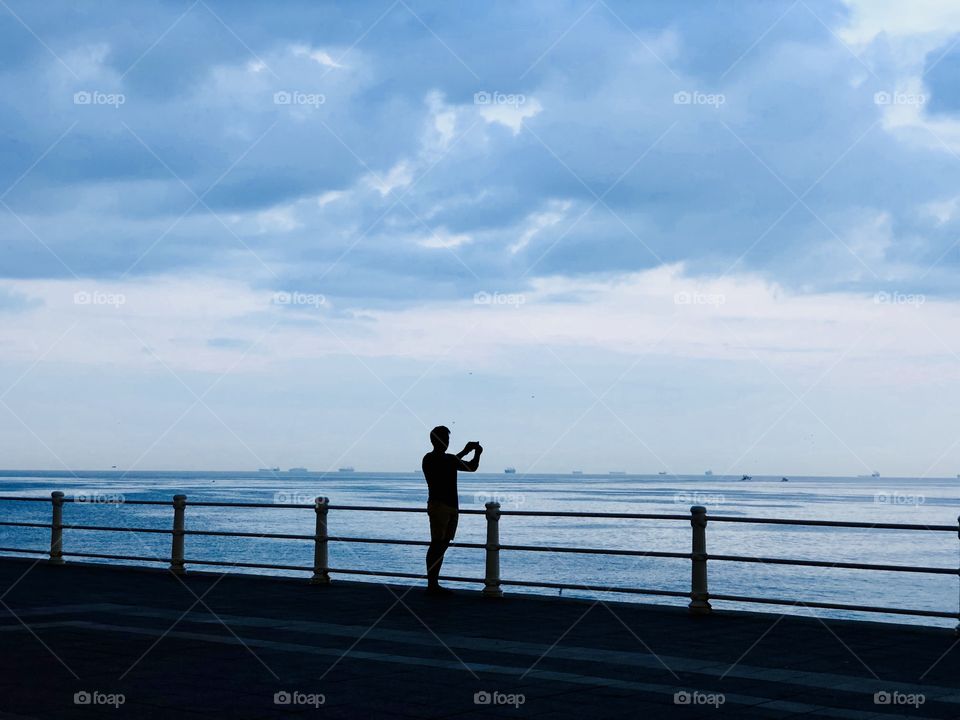 Man silhouette on the pier
