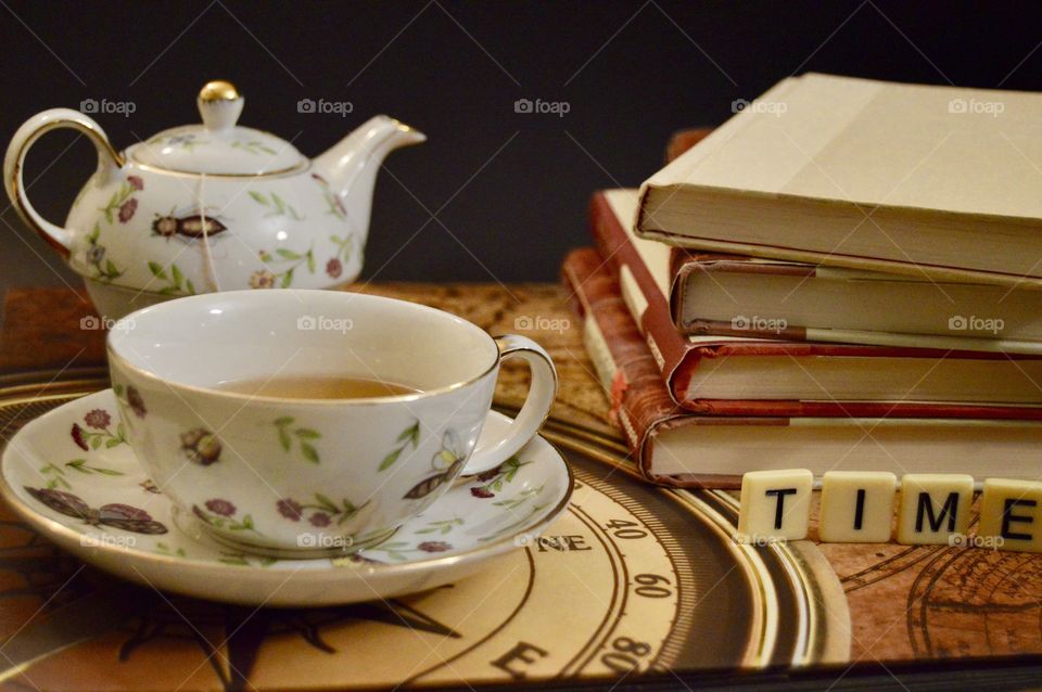 Tea with stack of books