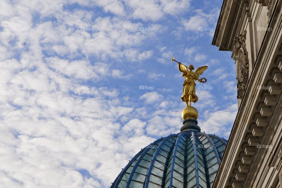 Clouds and statue