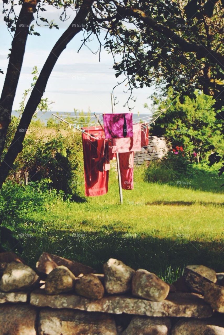 Laundry hanging to dry in the . Laundry hanging on a wire to dry in the wind 