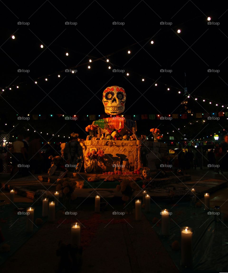 The central decoration of the Día de los Muertos celebration in San Antonio, Texas is a skull atop a fountain. The lights and colors are as festive as they are an appropriate memorial for souls of days past. 