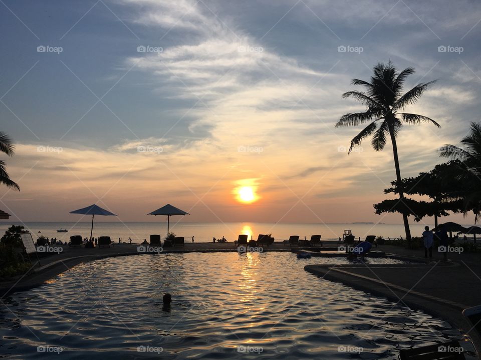 Mesmerizing beach sunset view by the pool 