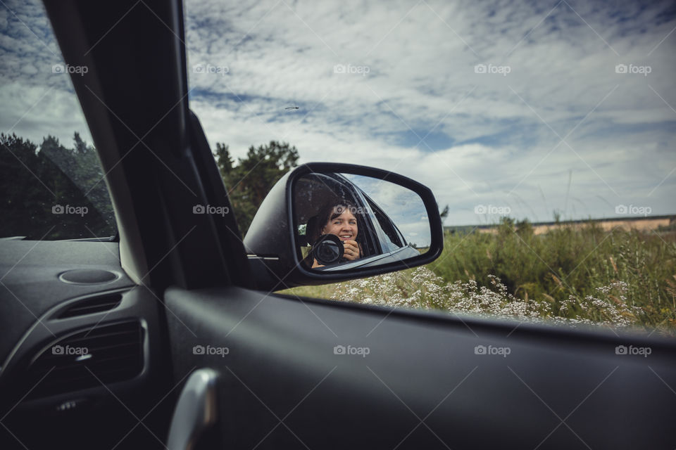 Self portrait in car mirror