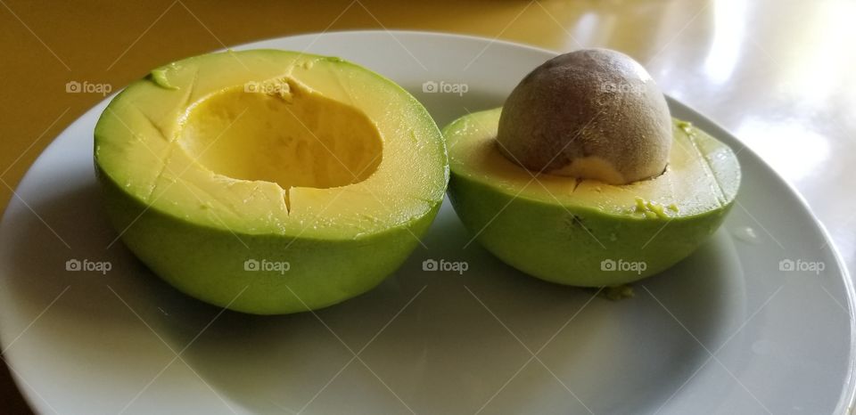 Peeled Avocado with Pit - Still Life Photo