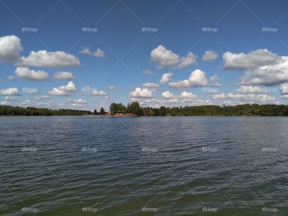 lake landscape summer time blue sky background