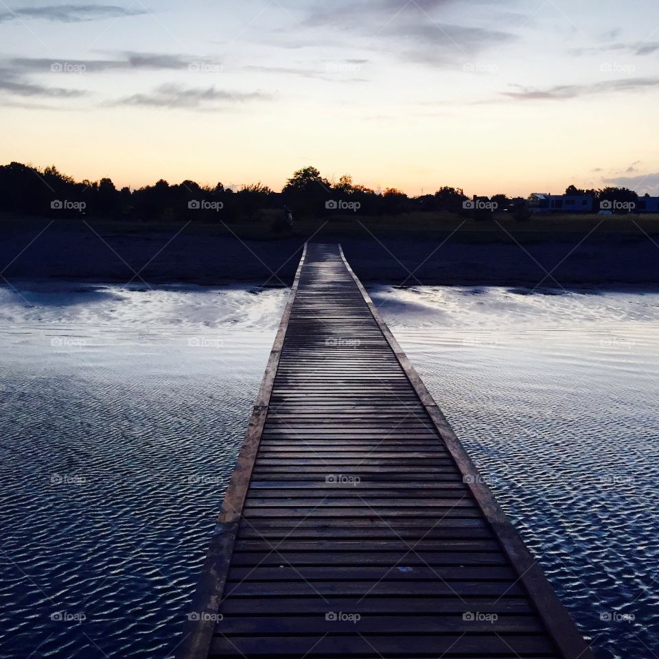 Bridge at the Beach by sunset . Sunset in Copenhagen 