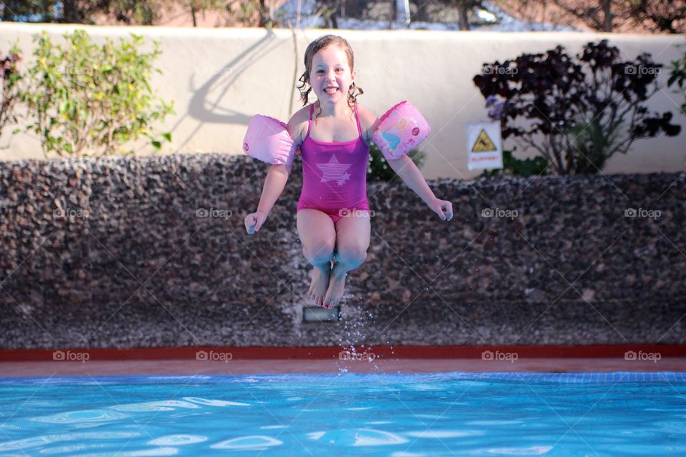 Splash!. High shutter speed of jump into pool, captured mid air 