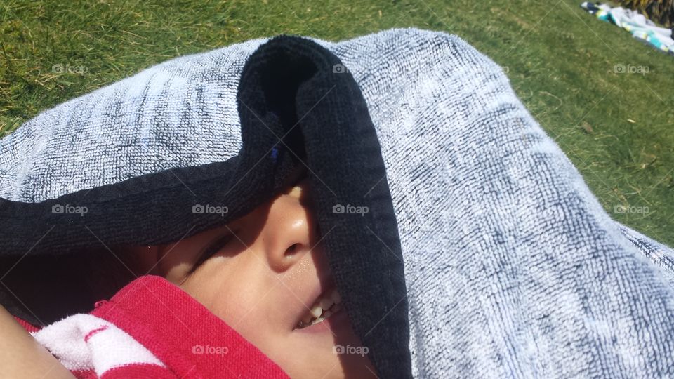 peekaboo boy at pool. our little one hiding from the sun