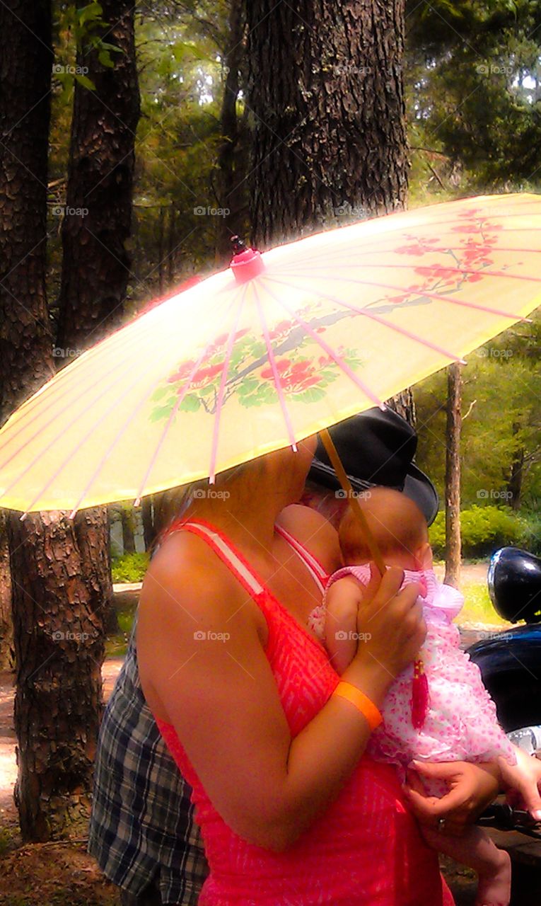 Under Umbrella. Baby under umbrella 