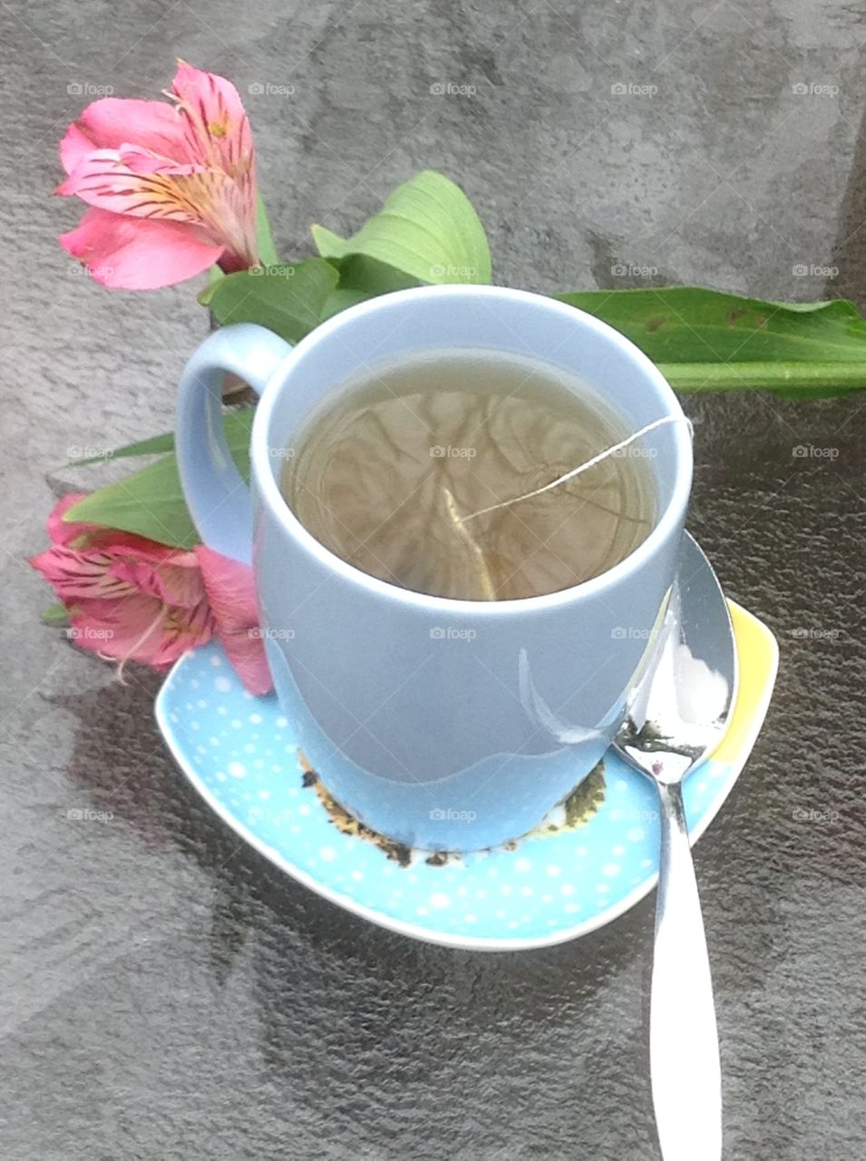 Having a cup of tea outdoors enjoying the beautiful Spring weather.