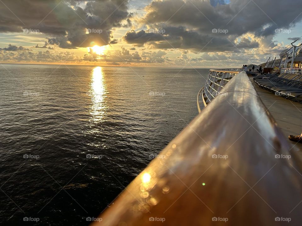 Sunset on deck railing