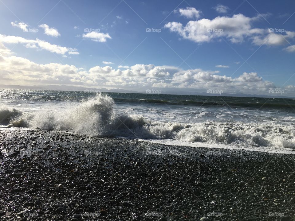 View of waves against clouds