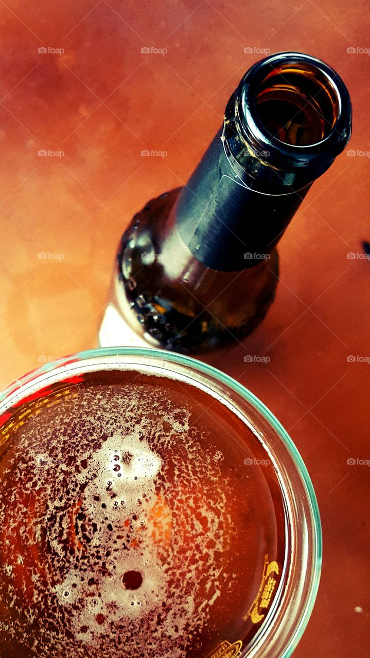 High angle view of beer glass and bottle
