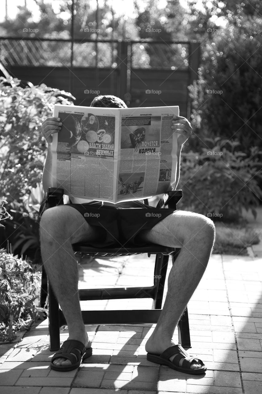 Man is reading newspaper