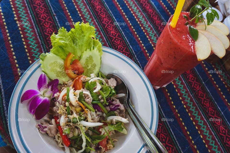 Spicy mama noodle salad and fruit smoothie in Chiang Mai, Thailand 