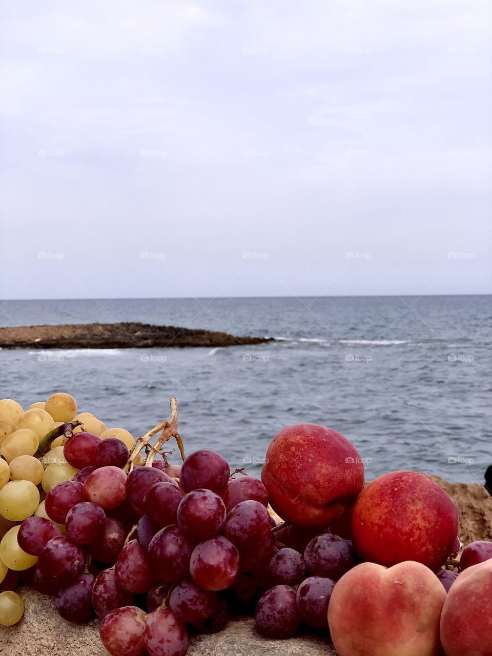 Red fruits in front the sea 