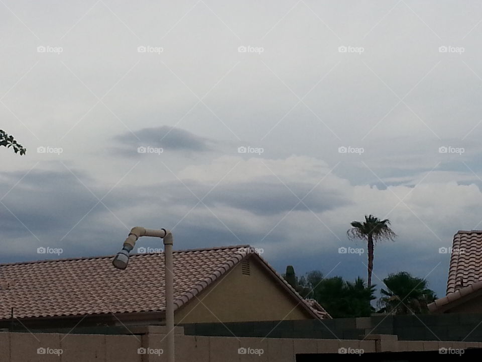 storm clouds over rooftops