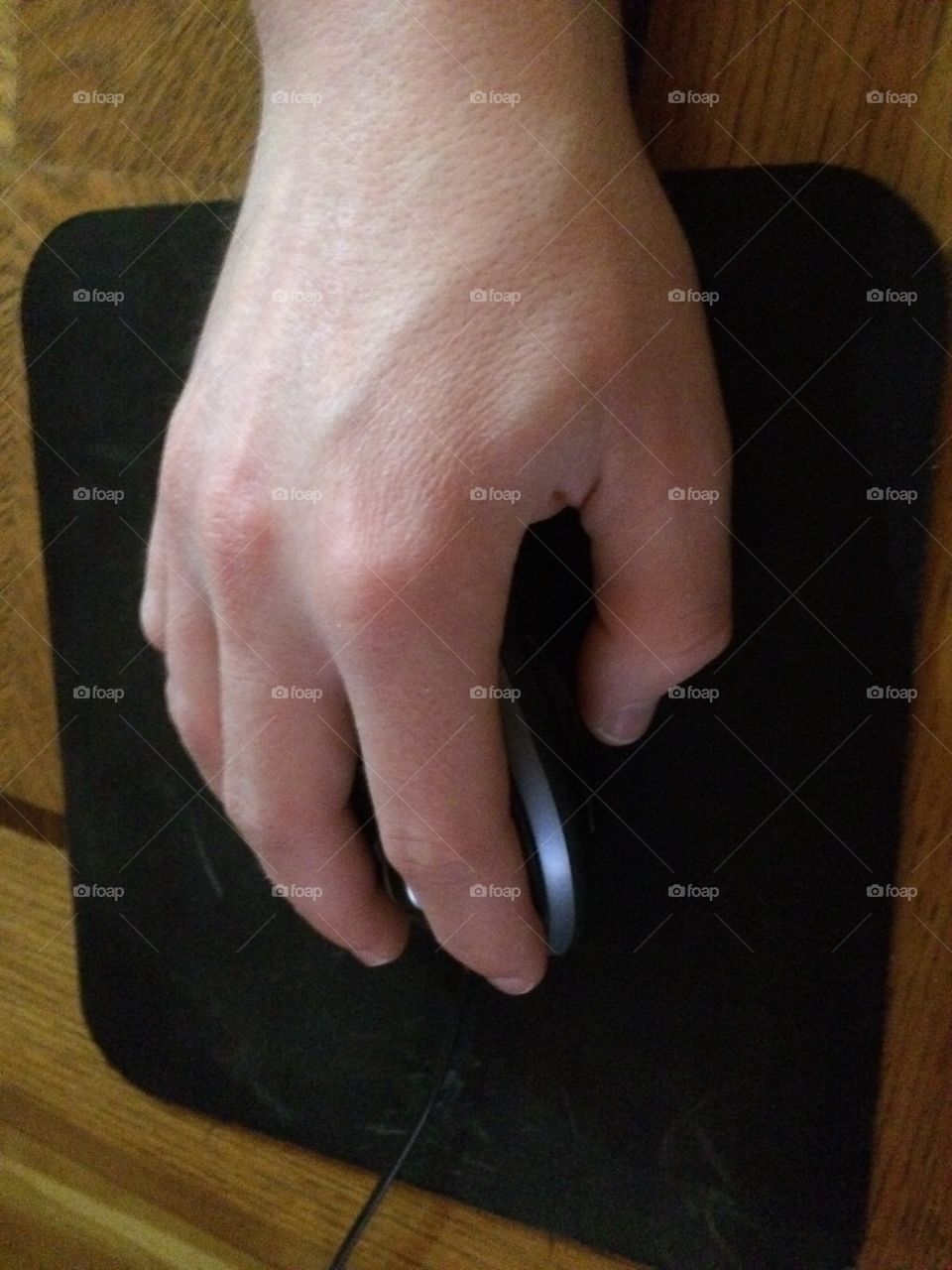 Hand on a mouse. 