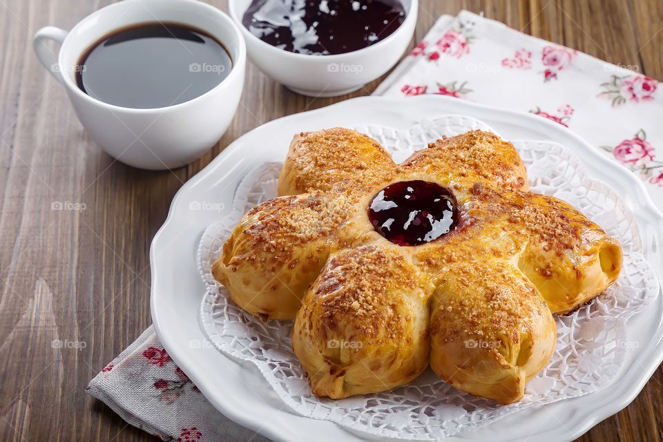 Flower shaped sweet bun
Close up of flower shaped sweet bun with jam.