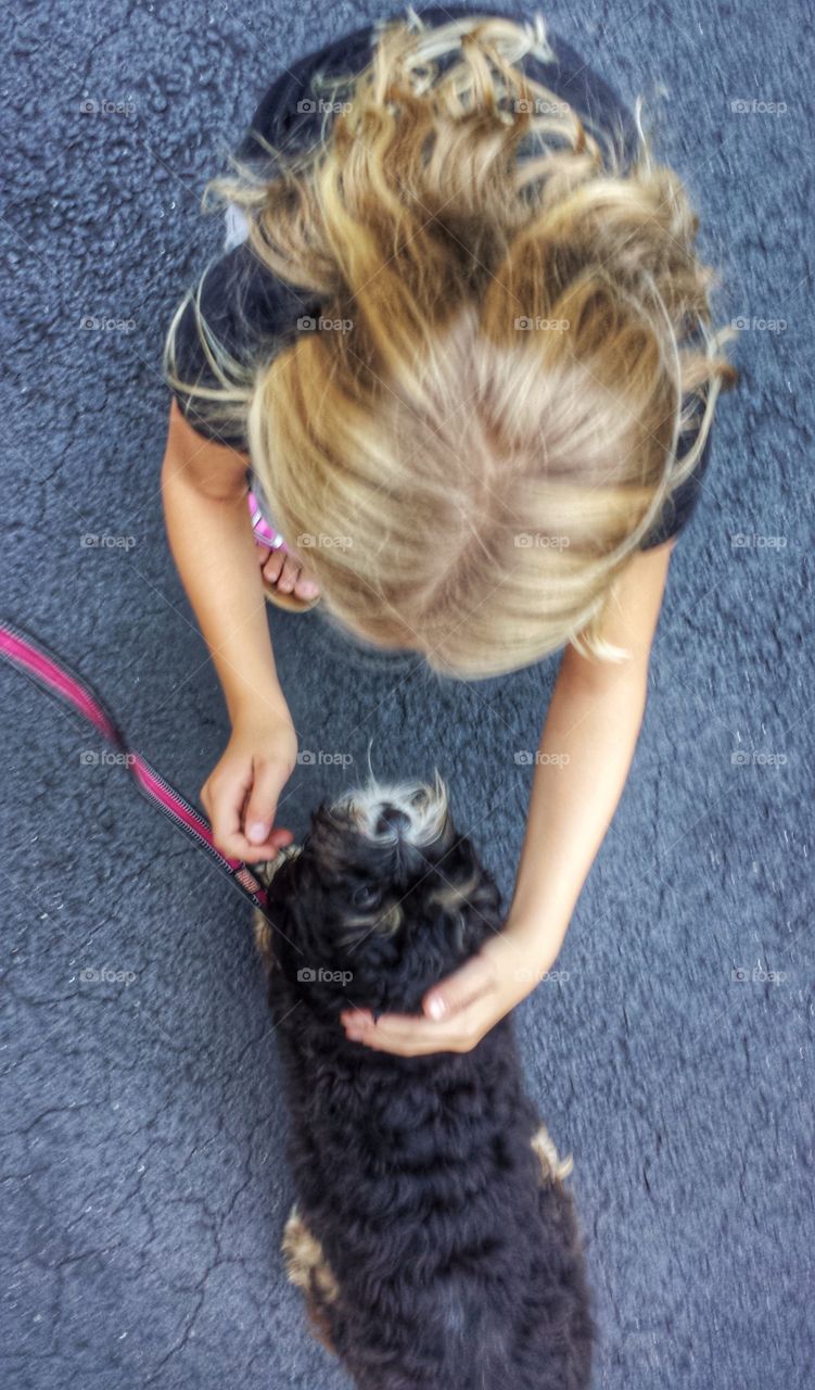 Girl and Dog. Making Friends