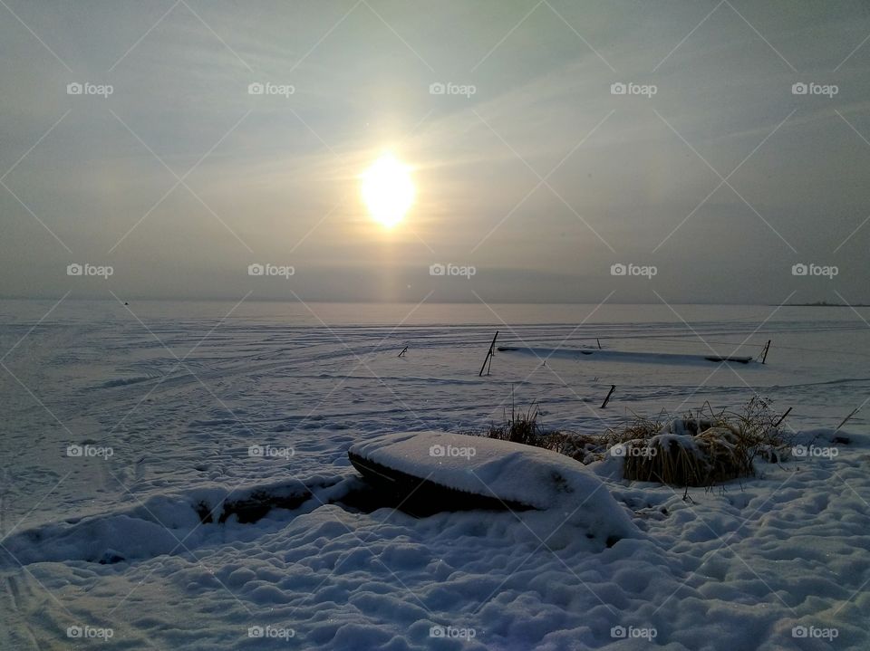 Sunset on the frozen lake Nero