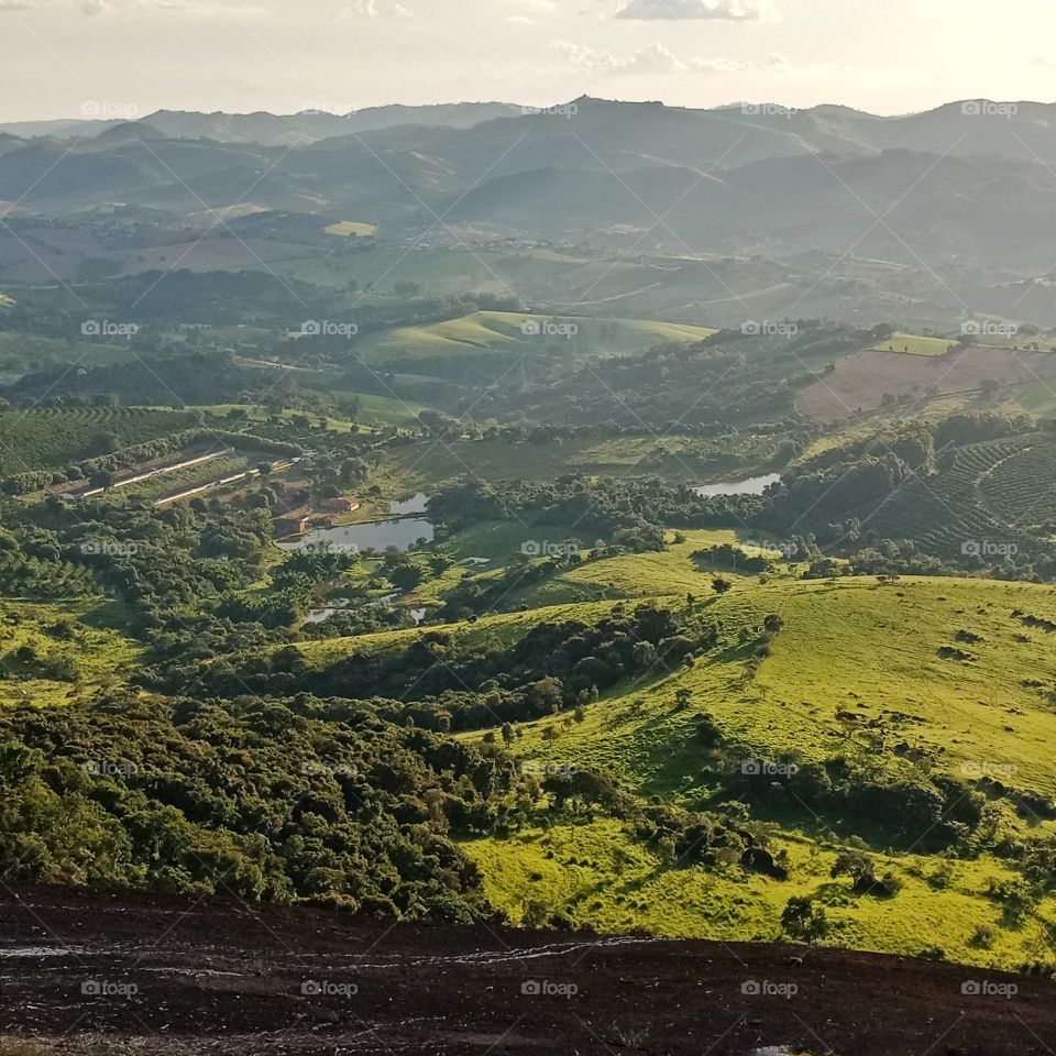 , Mountains,farms, a pond from a top view