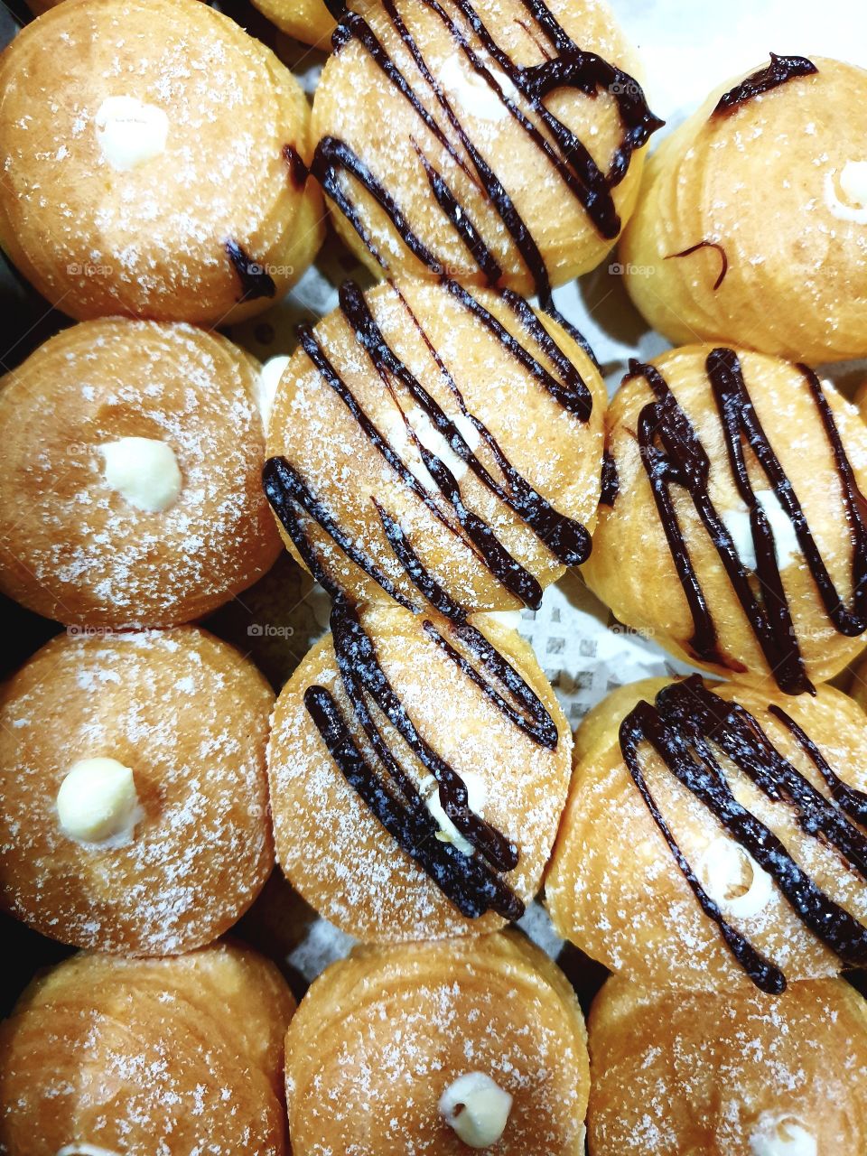 cream puff served with chocolate sauce