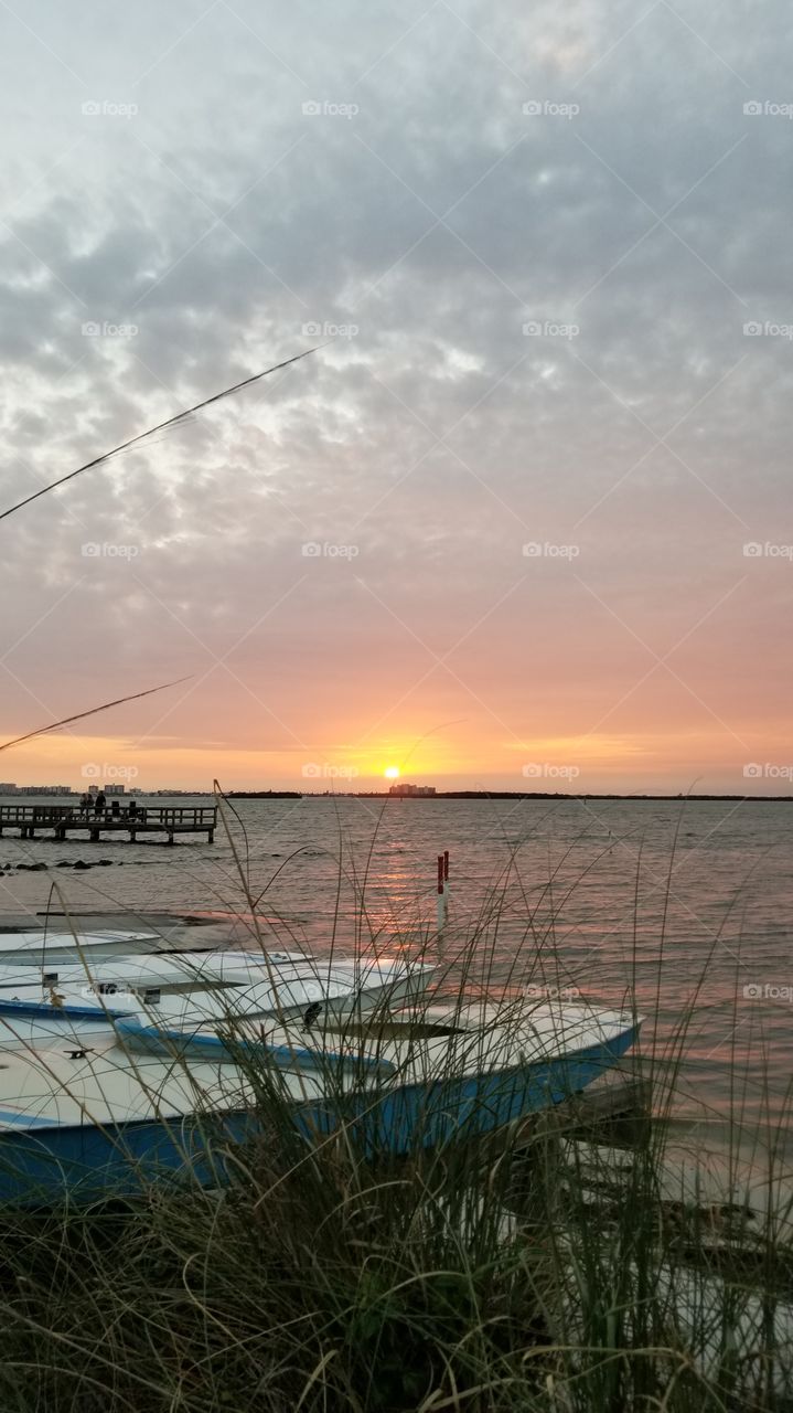 Boats on the water at sunset