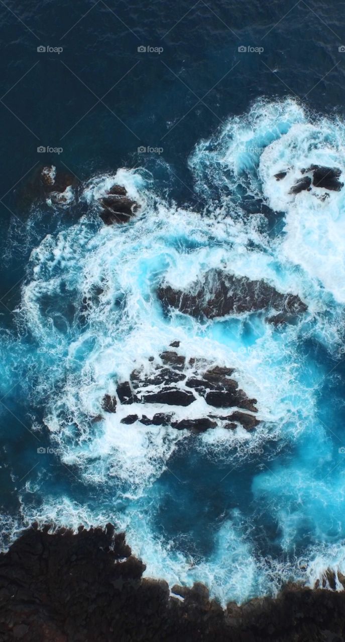 Beautiful drone view of rocks on the ocean 